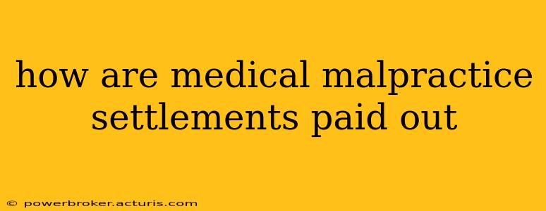 how are medical malpractice settlements paid out